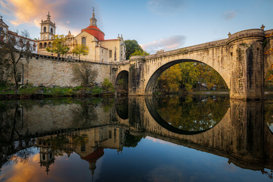 Sao Goncalo bridge over Tamega river and Sao Goncalo church at sunset in Amarante, north of Portugal 