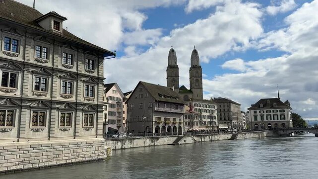 Zurich, Switzerland, Z&uuml;rich historic city center with Grossm&uuml;nster towers in the backgroud, Limmat river, Grossmunster is a Romanesque-style Protestant church in Z&uuml;rich, Switzerland
