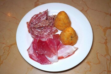 Food is any substance consumed to provide nutritional support for the body. It typically comes from plants, animals, or fungi and contains essential nutrients such as carbohydrates, proteins, fats, vi