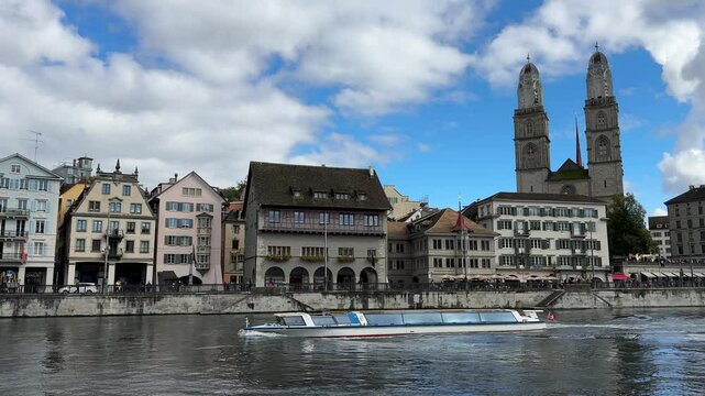 Zurich, Switzerland, Z&uuml;rich historic city center with Grossm&uuml;nster towers in the backgroud, Limmat river, Grossmunster is a Romanesque-style Protestant church in Z&uuml;rich, Switzerland