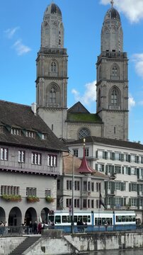 Zurich, Switzerland, Z&uuml;rich historic city center with Grossm&uuml;nster towers in the backgroud, Limmat river, Grossmunster is a Romanesque-style Protestant church in Z&uuml;rich, Switzerland