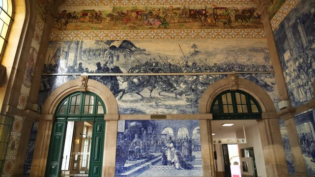 Interior of Sao Bento station with traditional hand painted blue tiles in Porto, Portugal. High quality 4k footage