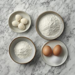 A white and grey marble table is set with flour in a bowl, baking powder on a plate, salt on a plate, eggs, sugar in a bowl, and water in a bowl