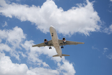 A plane soaring through the sky, symbolizing a journey of hope and new possibilities, with a clear blue backdrop.