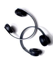 Modern headphones with advanced sound technology, featuring sleek design and high-quality audio performance, isolated on a neutral background.