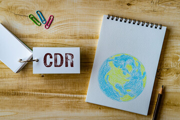 There is word card with the word CDR. It is an abbreviation for Carbon Dioxide Removal as...