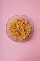 A bowl of fitness cereal, a healthy and nutritious breakfast choice packed with grains, seeds, and dried fruit for an energy boost to start the day.