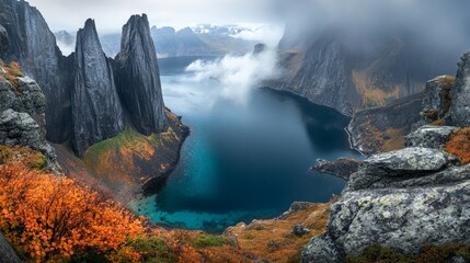 Naklejka premium A stunning fjord with steep cliffs plunging into crystal-clear water, surrounded by misty peaks,