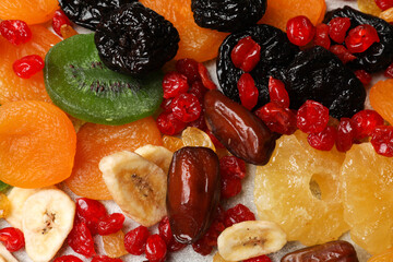 Mix of different dried fruits on table, top view