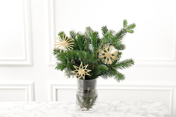 Beautiful decorated fir tree branches on white table. Christmas season