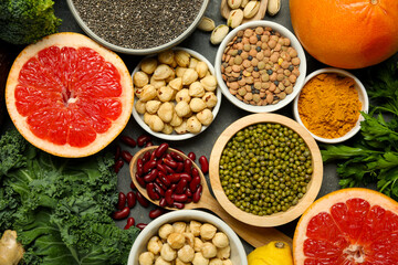Superfood. Different healthy food products on grey table, flat lay