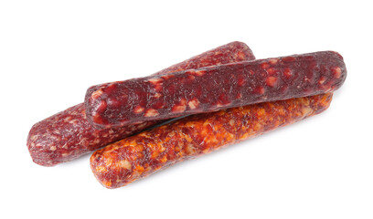 Many different dry cured sausages isolated on white