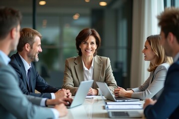 Confident diverse business team in professional attire discussing project in modern office meeting room with laptop and documents, collaboration, teamwork, corporate environment, bright atmosphere