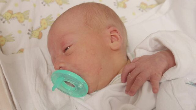 Newborn Baby Sucking on Pacifier. Shot on a GH5