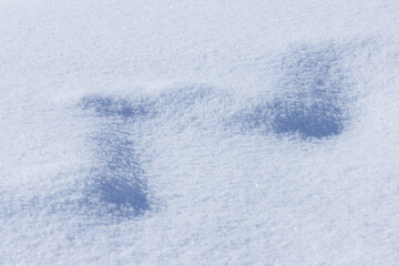zig-zag shape pattern on flat light blue snow surface