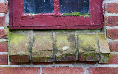 Architecture, wall and brick with windowsill on building for exterior, frame and apartment. Wood, real estate and property with concrete on house for pattern, texture and antique background.