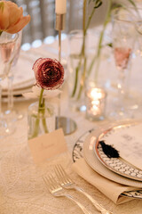 Elegant table setting with delicate flowers and fine dining elements for a special occasion