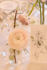 Beautiful ranunculus flower arrangement at an elegant table setting during a spring gathering celebration