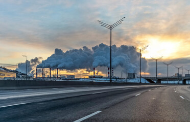 Smoke is coming out of the chimneys in the city