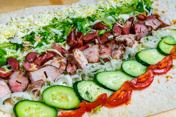 Delicious wrap filled with grilled meats and fresh vegetables