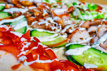 Delicious wrap filled with grilled chicken and fresh vegetables