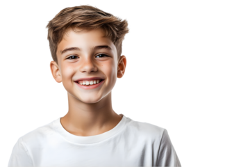 Cheerful boy smiling brightly against a plain background, radiating joy and happiness in a natural moment