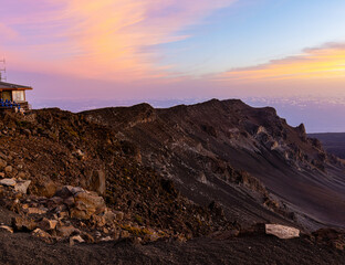 Tourists Watching Sunrise at Haleakala Visitor Center on The Rim of Haleakala Crater, Haleakala National Park, Maui, Hawaii, USA