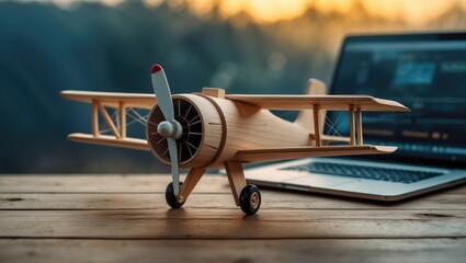Wooden airplane model set against a laptop symbolizing business growth and the aspiration to soar in your preferred industry.
