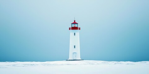 Lighthouse is standing on a snowy beach
