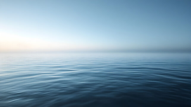 scene of calm sea water with a faint mist hovering just above the surface, blending into the horizon 