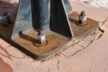 Rusted hardware on lower bracket for light pole.