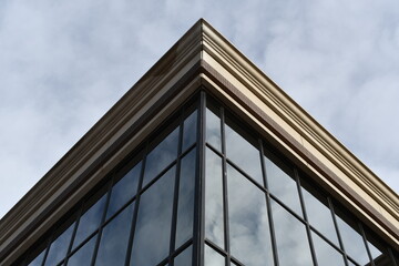 Corner shot of government building. Huge glass windows.