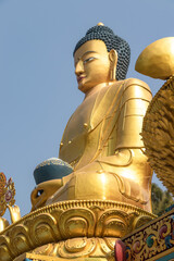 Golden statue of Buddha at Buddha Park, Swayambhunath, Kathmandu, Nepal