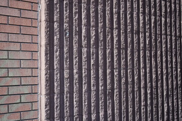 Multi textured red brick wall. 