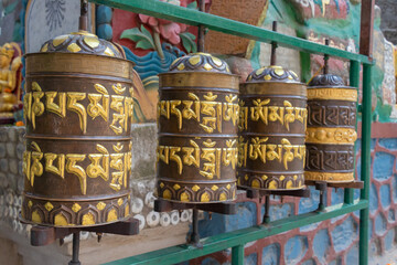 Prayer wheels is spun by devotees to aid for meditation and accumulating wisdom, good karma and putting negative energy aside