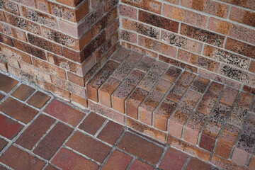 Red brick-work on downtown sidewalk.