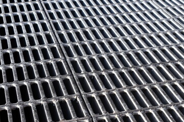 Metal grate for drainage.