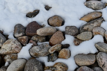 Small stones in snow.