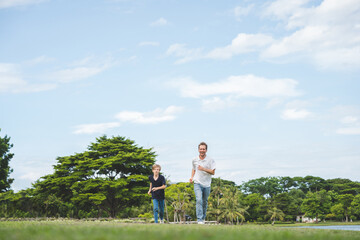 Happy family parent children having picnic outdoor activity. Enjoy happiness moment summer playing together including father mother son and daughter relaxing in the morning sunrise.