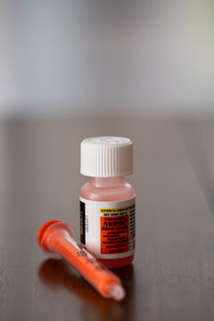 Concentrated Infants Motrin with syringe on the table 