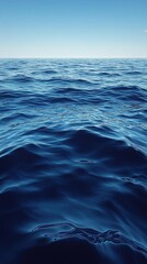 Fototapeta premium Vibrant Blue Ocean Water with Gentle Waves and Clear Sky in Daytime a Serene Natural Seascape Background