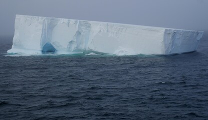 Iceberg  with ice cave in antarctica