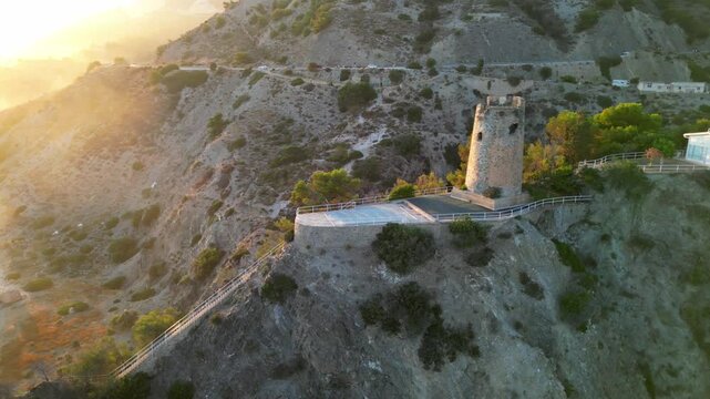 Drone shot of the Maro Tower at sunset in Nerja municipality, Malaga province, Andalusia, Spain