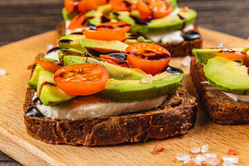 Delicious open-faced sandwich with fresh vegetables and creamy spread