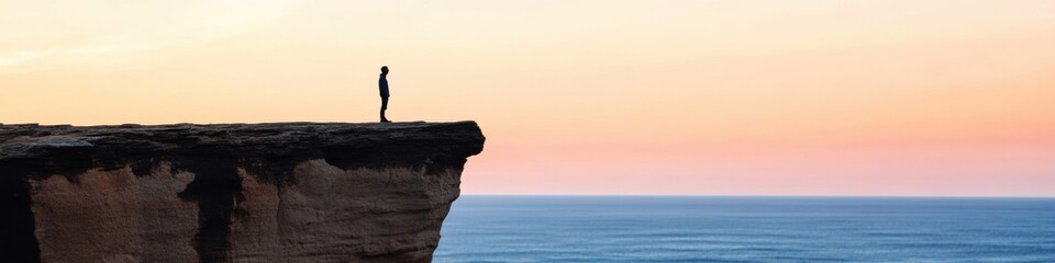 Fototapeta premium Sunlit Silhouette Adventure Minimalist Cliffside Dawn for Inspirational Marketing and Personal Growth-focused Outdoor Campaign Visuals