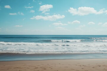 Sunny beach scene with gentle waves