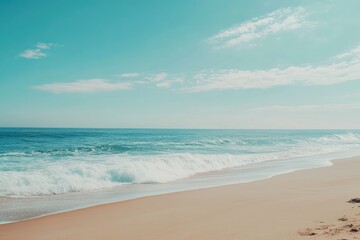 Tranquil beach scene, ocean waves, sandy shore, clear sky