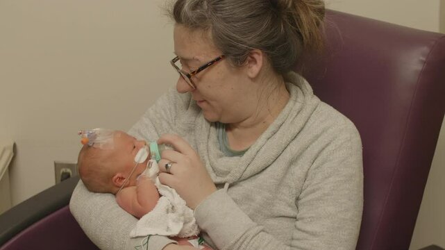 Mother Holding New Born at NICU Closeup