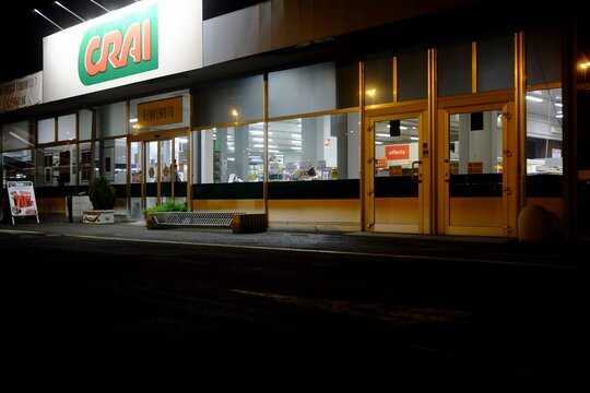 CRAI supermarket illuminated at night