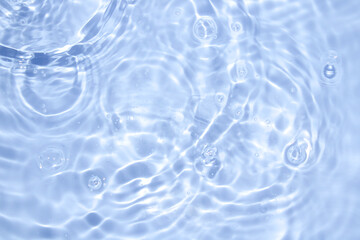 Gentle Water Ripples and Bubbles in Clear Blue Surface Reflection